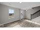 Bright room with staircase, hard floors, and neutral paint at 4160 Douro Trl, Westfield, IN 46062