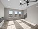 Sun-drenched living room features hardwood floors, neutral paint, recessed lighting, and large windows at 4160 Douro Trl, Westfield, IN 46062