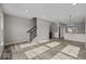 Open concept living area with hardwood floors and staircase at 4160 Douro Trl, Westfield, IN 46062
