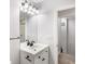 Bathroom features a sink with black hardware and a large mirror at 4242 Winthrop Ave, Indianapolis, IN 46205