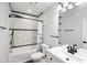 Bathroom features a shower-tub combination with stylish black hardware at 4242 Winthrop Ave, Indianapolis, IN 46205