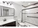 Updated bathroom featuring a sleek glass shower, modern fixtures, and tile surround at 4242 Winthrop Ave, Indianapolis, IN 46205