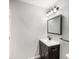 Bathroom featuring a sleek vanity with a marble countertop at 4242 Winthrop Ave, Indianapolis, IN 46205