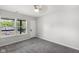 Bedroom featuring plush carpeting, fresh paint, and a large window with a view at 4242 Winthrop Ave, Indianapolis, IN 46205