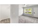 Bedroom with a closet, a large window, and access to a balcony at 4242 Winthrop Ave, Indianapolis, IN 46205