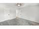 A spacious bedroom with soft gray carpet and a neutral color scheme at 4242 Winthrop Ave, Indianapolis, IN 46205