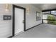 Inviting front porch with stylish lighting fixtures creating a warm and welcoming entrance to the home at 4242 Winthrop Ave, Indianapolis, IN 46205