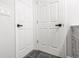 Hallway features neutral walls and modern doors at 4242 Winthrop Ave, Indianapolis, IN 46205