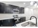 Beautiful kitchen features stainless steel appliances, sleek countertops, stylish backsplash, and ample storage at 4242 Winthrop Ave, Indianapolis, IN 46205