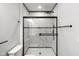 Bathroom featuring a sleek glass shower with white tiling at 4242 Winthrop Ave, Indianapolis, IN 46205