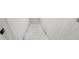 View of the staircase leading down, featuring white walls at 4242 Winthrop Ave, Indianapolis, IN 46205