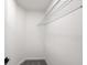 Bright walk-in closet with neutral carpet and metal shelving at 4242 Winthrop Ave, Indianapolis, IN 46205