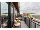 Cozy balcony with chairs and black metal railing overlooking street and building views at 440 S Meridian Unit A-Bldg D St, Greenwood, IN 46142