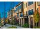 Charming street view showcasing modern townhomes with manicured landscaping and inviting curb appeal at 440 S Meridian Unit A-Bldg D St, Greenwood, IN 46142