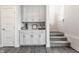 Mud room features built-in cabinets, countertop, and an entrance to the home with access to a staircase at 444 S Meridian Unit B-Bldg D St, Greenwood, IN 46142