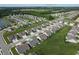 Expansive aerial view of a suburban neighborhood, showcasing well-maintained lawns and the Bear Slide Golf Club in the distance at 50 Hovden Dr, Cicero, IN 46034