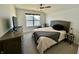 Comfortable bedroom with queen-sized bed, and large window offering natural light at 50 Hovden Dr, Cicero, IN 46034