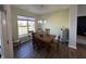 Cozy dining room with a wooden table, chairs, and a window with neighborhood views at 50 Hovden Dr, Cicero, IN 46034