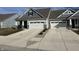 Exterior elevation of home with a two-car garage and inviting curb appeal at 50 Hovden Dr, Cicero, IN 46034