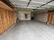 Spacious garage with ample storage, shelving, and clean epoxy flooring at 50 Hovden Dr, Cicero, IN 46034