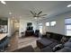 Bright and airy living room with a ceiling fan, large sectional sofa, and lots of windows at 50 Hovden Dr, Cicero, IN 46034
