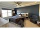 Relaxing bedroom featuring a tray ceiling, neutral carpet, and a peaceful navy accent wall at 50 Hovden Dr, Cicero, IN 46034