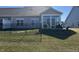 Back exterior of home showing outdoor patio with sunroom at 50 Hovden Dr, Cicero, IN 46034