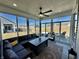 Cozy sunroom featuring wall to wall windows providing outdoor views with ample seating at 50 Hovden Dr, Cicero, IN 46034