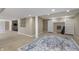 Spacious basement with carpeting, recessed lighting, and ample open area for recreation and storage at 504 Stony Creek Cir, Noblesville, IN 46060