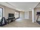 Finished basement featuring a TV area, workout space, and double doors to the outside at 504 Stony Creek Cir, Noblesville, IN 46060