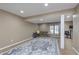 Large basement area with ample lighting and an area rug at 504 Stony Creek Cir, Noblesville, IN 46060