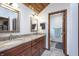 Inviting bathroom features double sinks, granite counters, and attractive lighting at 504 Stony Creek Cir, Noblesville, IN 46060