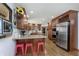 The home's eat-in kitchen boasts stainless appliances, granite counters and a breakfast bar with seating at 504 Stony Creek Cir, Noblesville, IN 46060