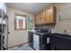 Well-equipped laundry room boasts cabinets, sink and newer washer/dryer at 504 Stony Creek Cir, Noblesville, IN 46060