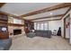 Cozy living room with fireplace, built-in bookshelves, and comfortable seating at 504 Stony Creek Cir, Noblesville, IN 46060