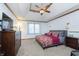 Spacious bedroom with modern décor, plush carpeting, and ceiling fan at 504 Stony Creek Cir, Noblesville, IN 46060