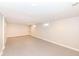 Large unfinished basement featuring windows for natural light and gray epoxy flooring at 520 N Parker Ave, Indianapolis, IN 46201