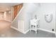 Basement laundry area featuring an utility sink and stairs to the main floor at 520 N Parker Ave, Indianapolis, IN 46201