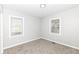 Neutral bedroom featuring carpet, window, and white trim at 520 N Parker Ave, Indianapolis, IN 46201