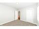 Neutral bedroom features an open closet and white trim at 520 N Parker Ave, Indianapolis, IN 46201