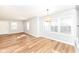 Bright living room featuring hardwood floors, natural light, and a view into the kitchen at 520 N Parker Ave, Indianapolis, IN 46201