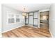 Bright living room with custom built-ins, hardwood floors, and modern light fixture near the kitchen at 520 N Parker Ave, Indianapolis, IN 46201