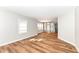 Bright living room featuring hardwood floors, natural light, and a view into dining area at 520 N Parker Ave, Indianapolis, IN 46201
