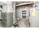 The basement features mechanicals, concrete walls, and ductwork at 59 E Troy Ave, Indianapolis, IN 46225