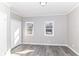 Bedroom with gray walls and trim features two windows allowing for plenty of natural light at 59 E Troy Ave, Indianapolis, IN 46225