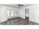 Bedroom featuring bright windows and dark wood floors at 59 E Troy Ave, Indianapolis, IN 46225