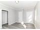 Bedroom with natural light from the window and doors at 59 E Troy Ave, Indianapolis, IN 46225