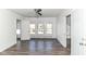 Bedroom with large windows and dark wood floors at 59 E Troy Ave, Indianapolis, IN 46225