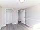 Bright bedroom featuring an open closet and a view into another room at 59 E Troy Ave, Indianapolis, IN 46225