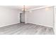 Inviting living room featuring gray floors, fresh paint, and modern lighting at 59 E Troy Ave, Indianapolis, IN 46225